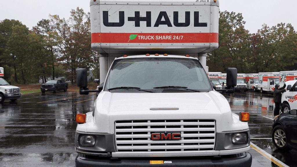 A photo of a U-Haul truck parked on a street, ready for transportation.